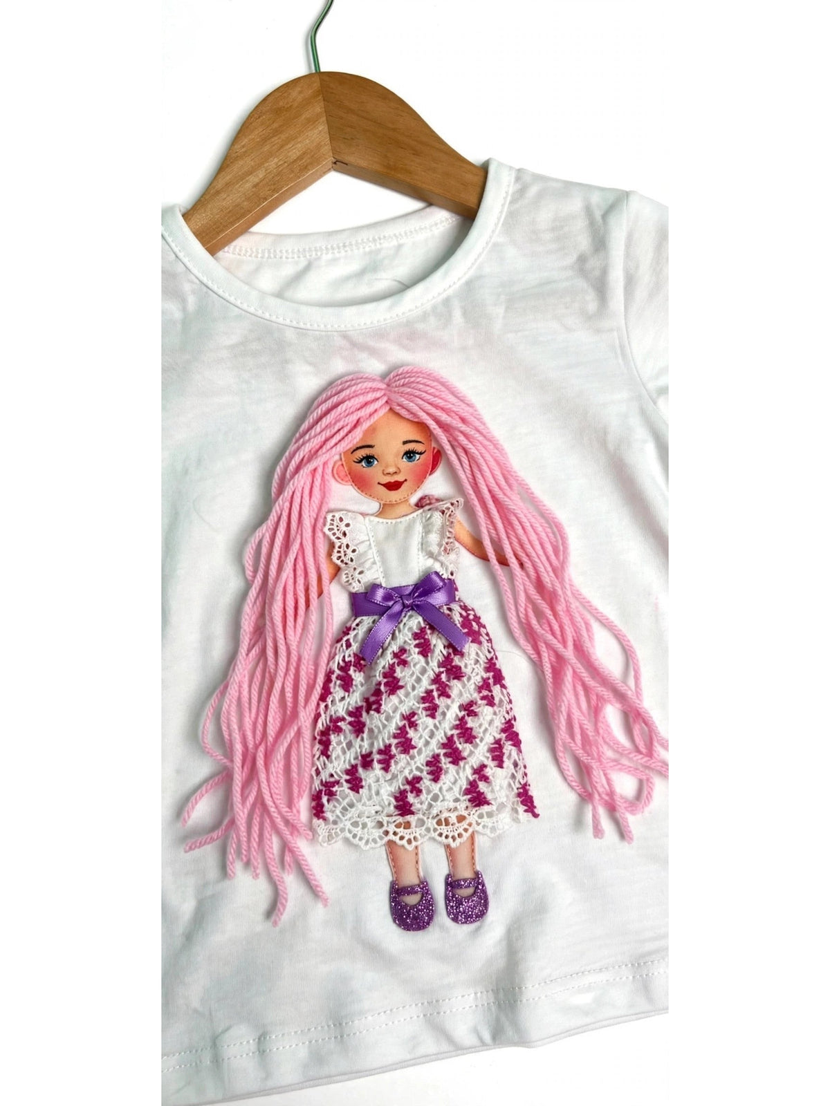 Handmade pink hair doll design in white ruffle dress on white T-shirt, product photo