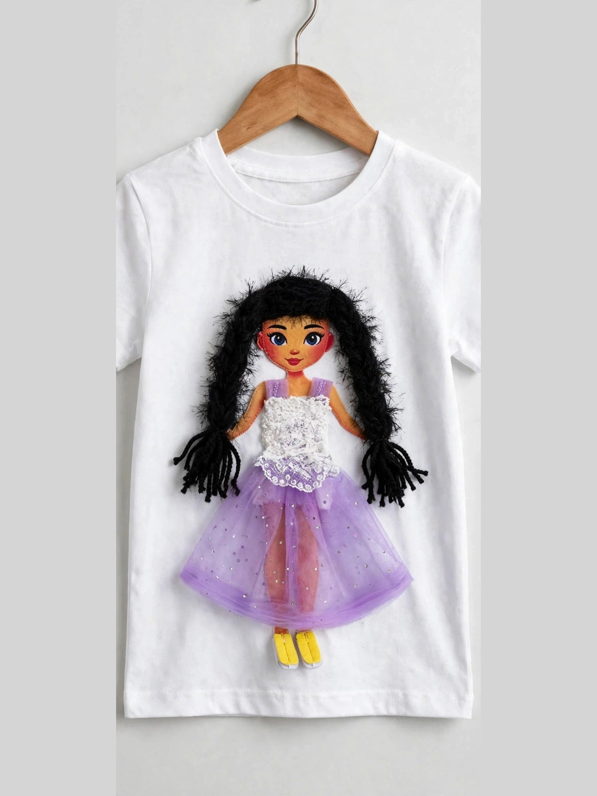 White T-shirt with handmade doll appliqué, dark yarn hair and purple tulle skirt