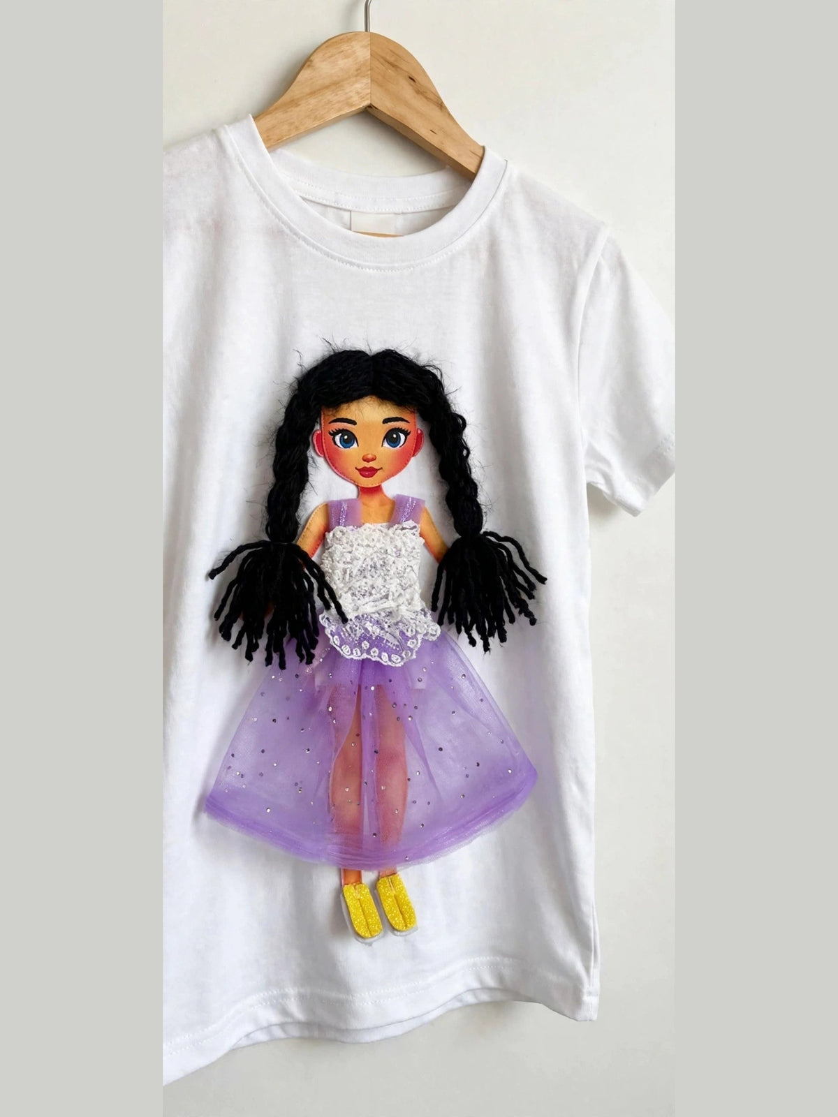 White doll T-shirt with dark-haired doll in purple tulle skirt, alternate product photo