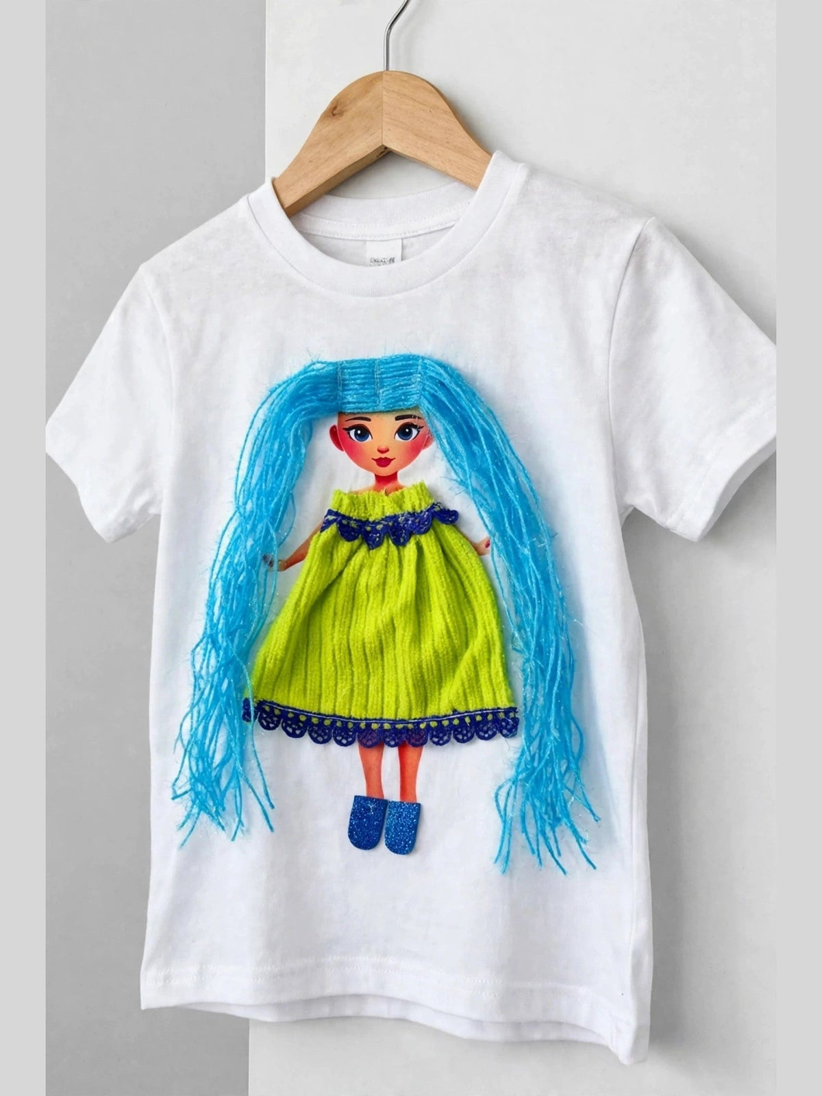 White doll T-shirt with blue-haired doll in lime dress, alternate product photo