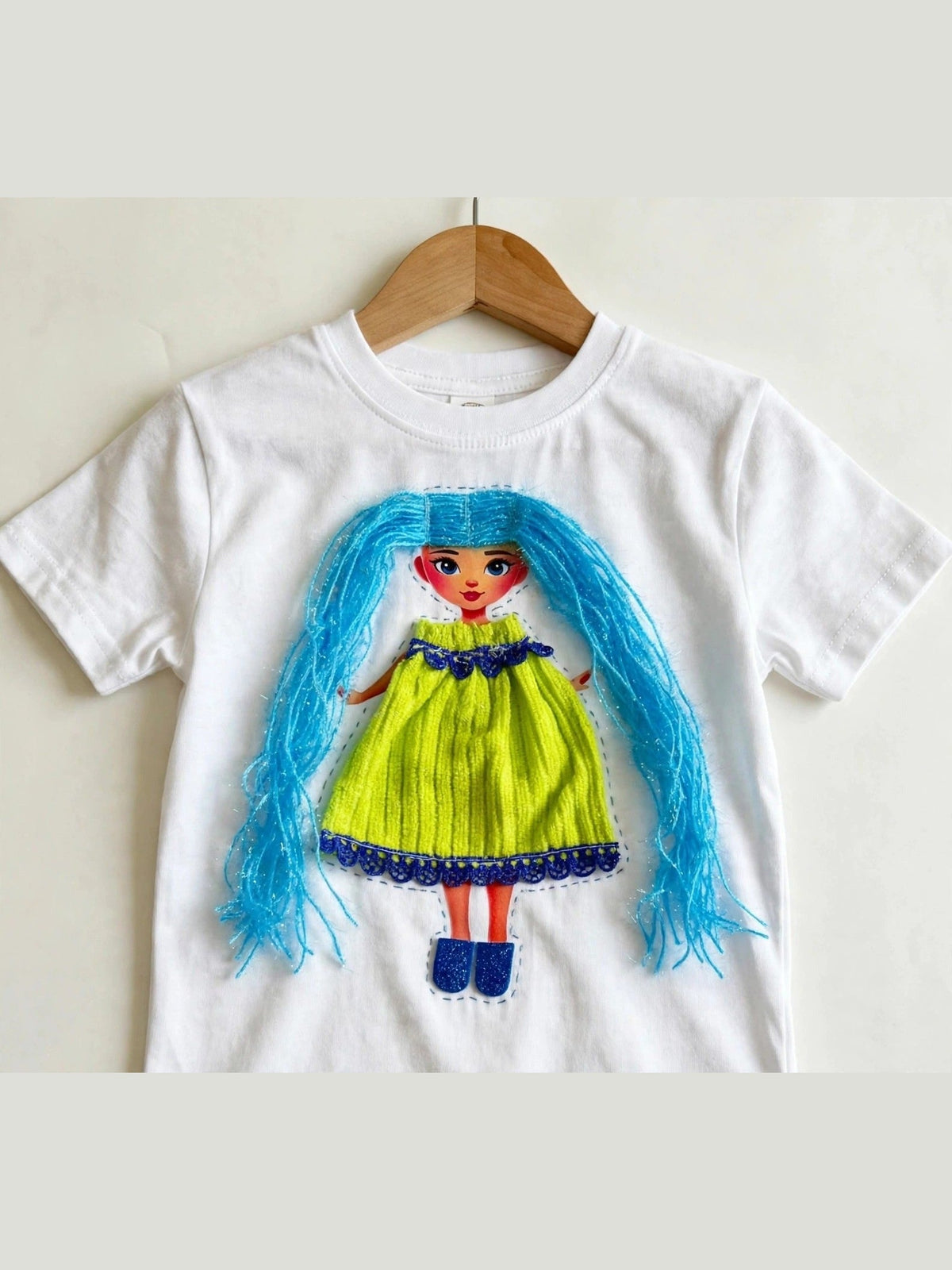 Handmade blue hair doll design in lime dress on white T-shirt, product photo