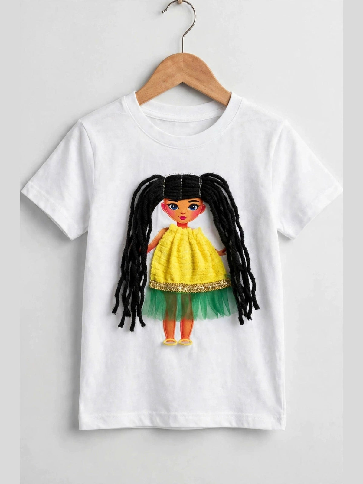White T-shirt with handmade doll appliqué, black yarn hair and yellow-green dress