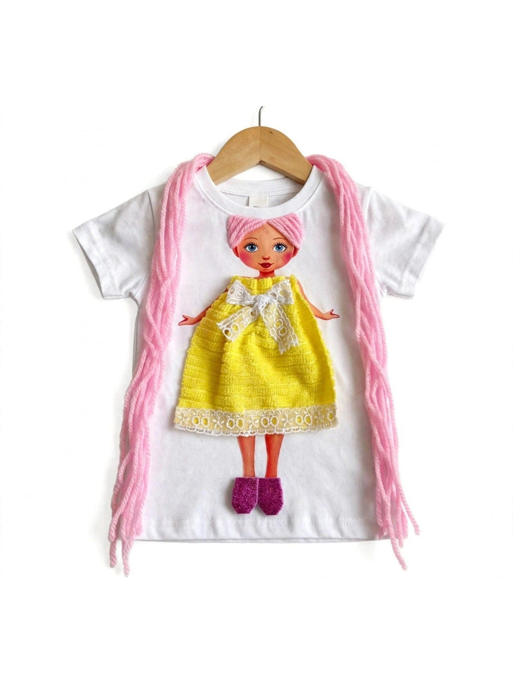 White T-shirt with handmade doll appliqué, pink yarn hair and yellow dress